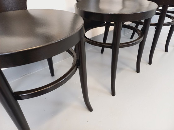 Image 1 of Set van 4 vintage Baumann Mouette stoelen in zwart hout uit de jaren 70.