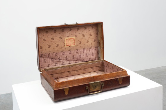 Image 1 of Vintage brown leather suitcase with copper details, China 1900s
