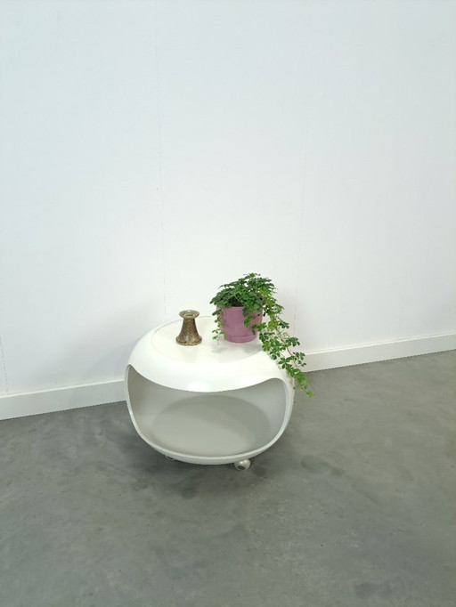 White space age coffee table on wheels