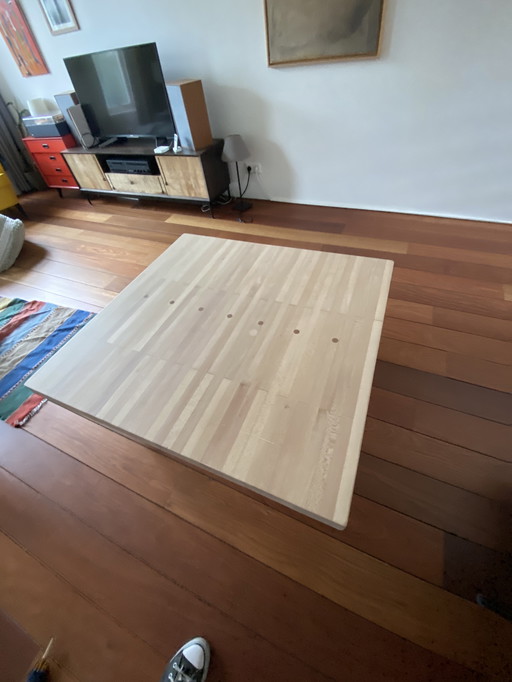 Coffee table with a historic charm. Old bowling lane wood top. Stylish chassis of powder coated black metal