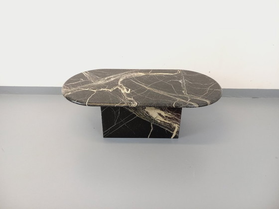 Image 1 of Vintage oval coffee table in black marble from the 1970s