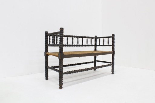 Banc à bobines vintage avec assise en jonc, années 1920
