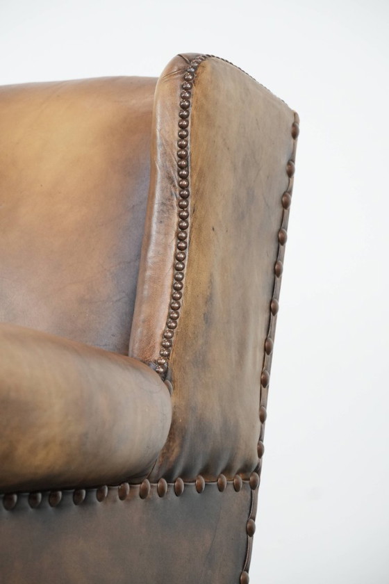 Image 1 of Ohrensessel im englischen Stil aus Kuhfell