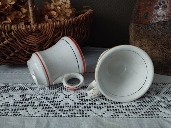 Image 1 of Een paar Sarreguemines ondoorzichtige porseleinen vuurkorfjes (1857-1900)