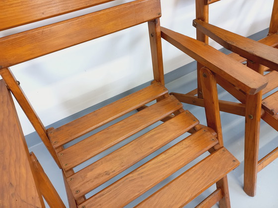 Image 1 of Vintage garden furniture consisting of a table with extensions and 4 wooden armchairs from the 60s