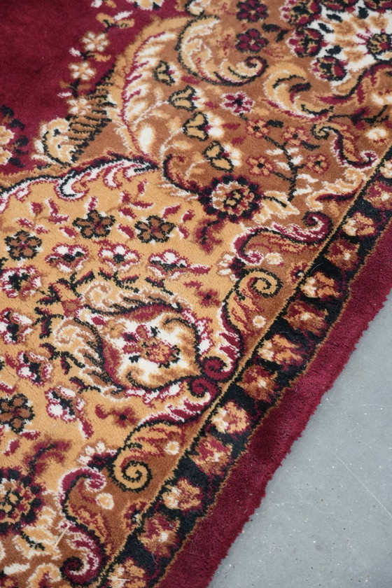 Image 1 of Grande tappeto con bellissimi motivi prevalentemente nei toni del rosso e del giallo 295x200cm