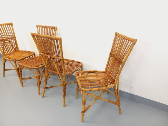 Image 1 of Suite de 4 chaises vintage Audoux Minet en rotin des années 50 60