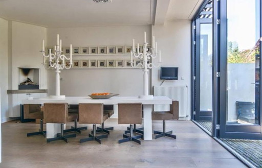 24 signed photographs by Pim Westerweel in loose frames.