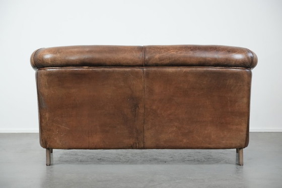 Image 1 of Vintage 2 zits bank gemaakt van cognac kleurig schapenleer in Engelse stijl