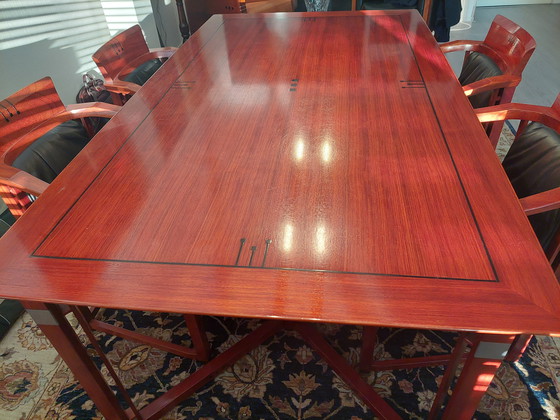 Image 1 of Rectangular long dining table with four luxurious leather-upholstered chairs by Schuitema Stadskanaal. In very good condition.