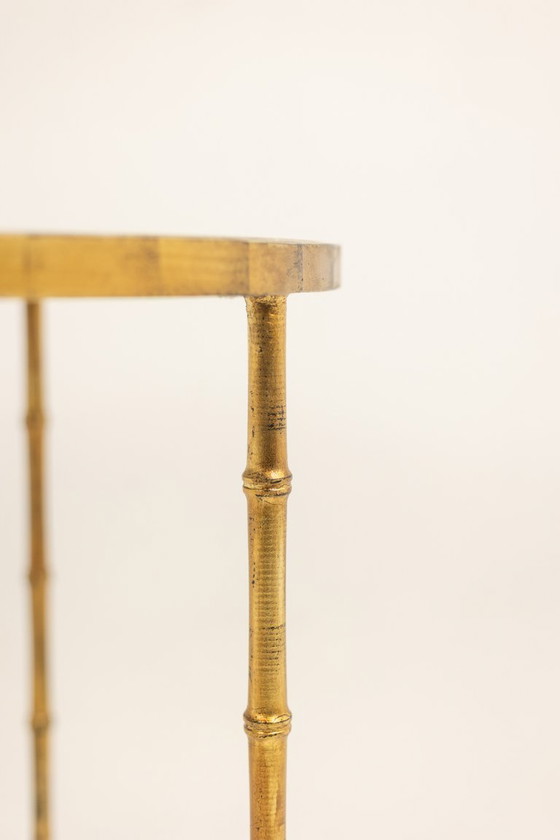 Image 1 of Pedestal table. Gilt metal base and grey marble top. 20th century.