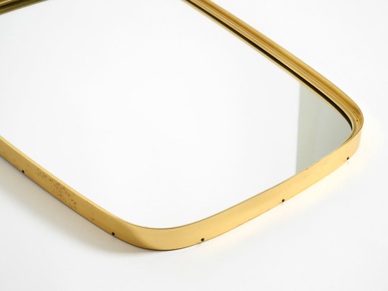 Image 1 of A pair of rare original Mid Century Modern "Münchener Zierspiegel" wall mirrors with heavy brass frames