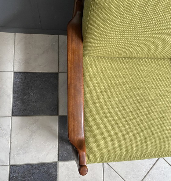 Image 1 of Gele stoffen en houten relaxstoel uit de jaren 60.