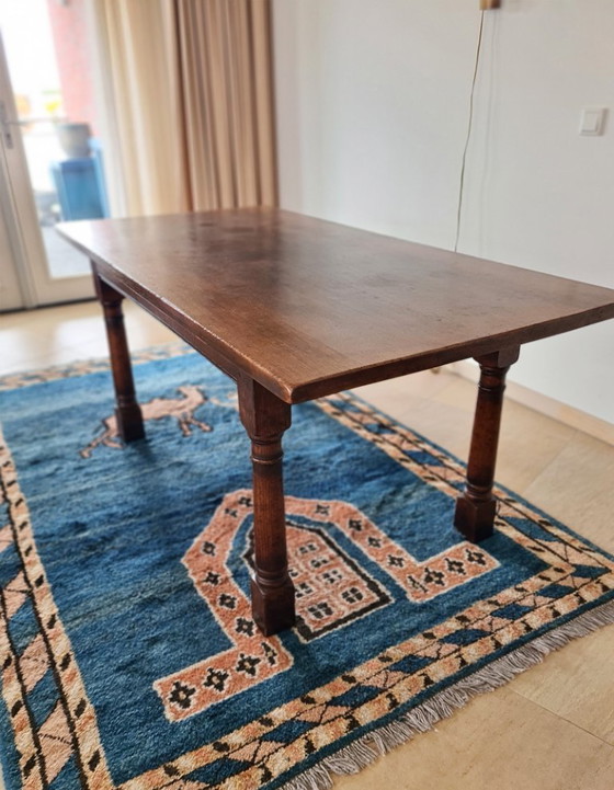 Image 1 of Massief eikenhouten eettafel met 6 bijpassende stoelen 