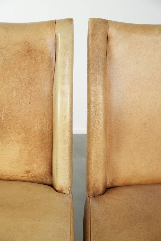 Image 1 of 6 chaises de salle à manger en cuir de vachette clair, avec une belle couleur claire, une assise confortable et un dossier haut.