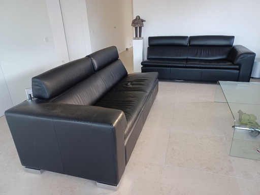 Leolux sofa set, model Howlazy, in black aniline leather and polished aluminum legs.