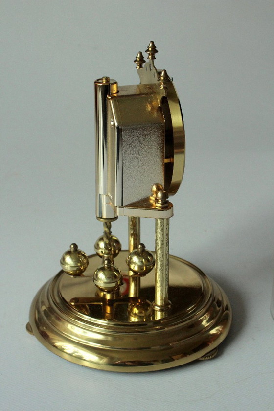 Image 1 of Elegant Hermle brass torsion pendulum clock with glass dome - Vintage