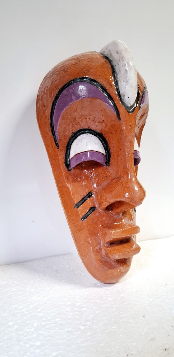 Image 1 of Masque africain en céramique .