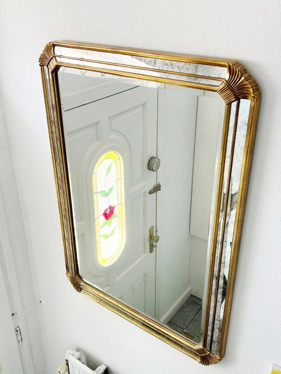 Image 1 of Vintage Deknudt trapezoid mirror – gold frame with smoked mirror glass – Hollywood Regency style – 95 × 69 cm