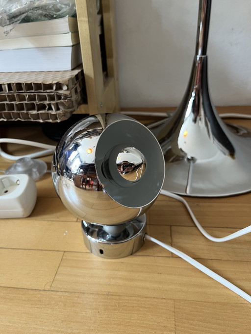 2 lampes de table à œil chromé