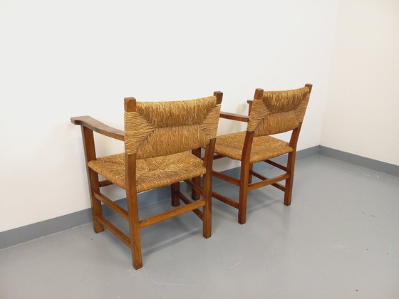 Image 1 of Suite van 2 vintage Brutalistische fauteuils in eiken en stro uit de jaren 60