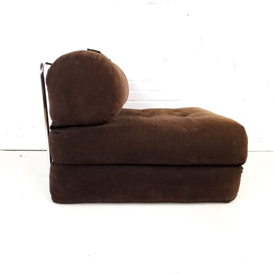 Image 1 of Poltrona letto vintage anni '70, in velluto a coste marrone con bottoni decorativi.