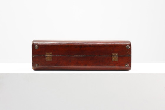 Image 1 of Vintage brown leather suitcase with copper details, China 1900s
