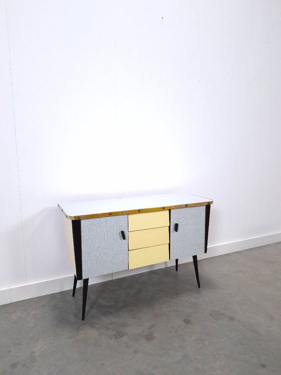 Image 1 of 1950s light blue-yellow cabinet with Formica and slanted legs
