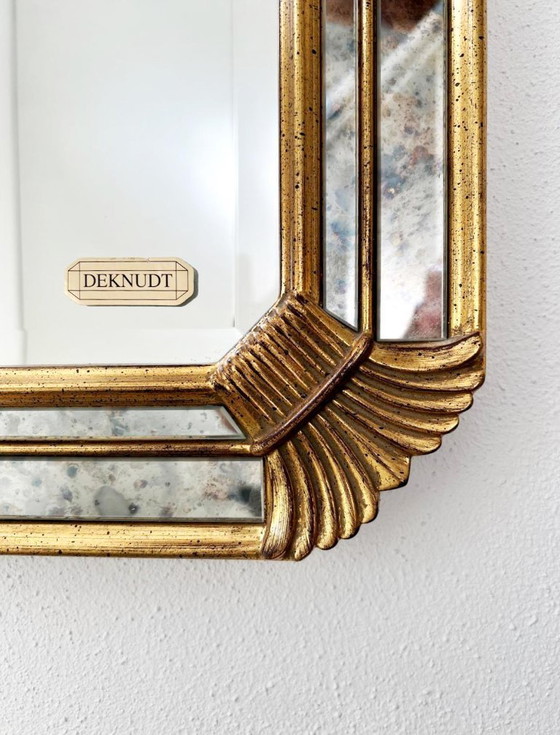 Image 1 of Vintage Deknudt trapezoid mirror – gold frame with smoked mirror glass – Hollywood Regency style – 95 × 69 cm
