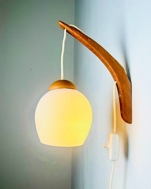 Floating wall lamp in teak and opaline glass by Uno & Östen Kristiansson for Luxus, Sweden, 1960s