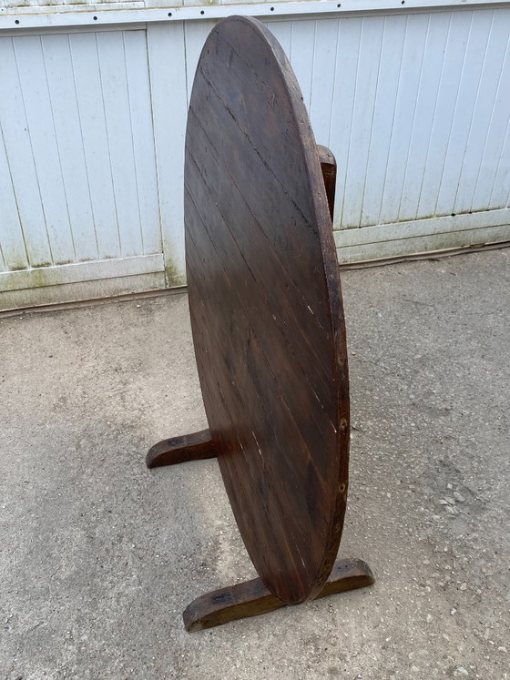 Image 1 of antique folding round winemaker's target table with tilting top
