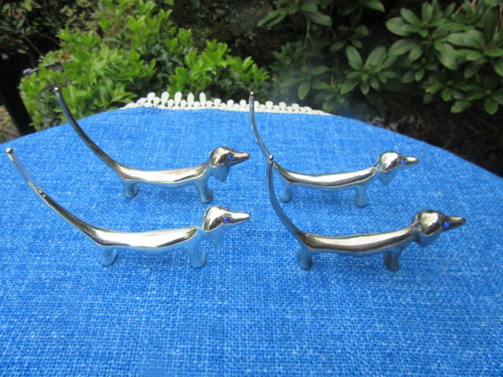 Image 1 of 4 Silver Plated Knife Rests Dachshund Dog Long Tail Blue Eyes vintage