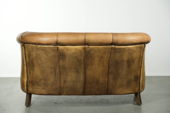 Image 1 of Karaktervolle schapenleren 2 zits bank met een mooie vintage look