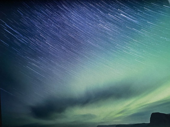 Image 1 of Aurora boreale islandese e scie stellari, 100x150cm, cornice museale, edizione 1/3