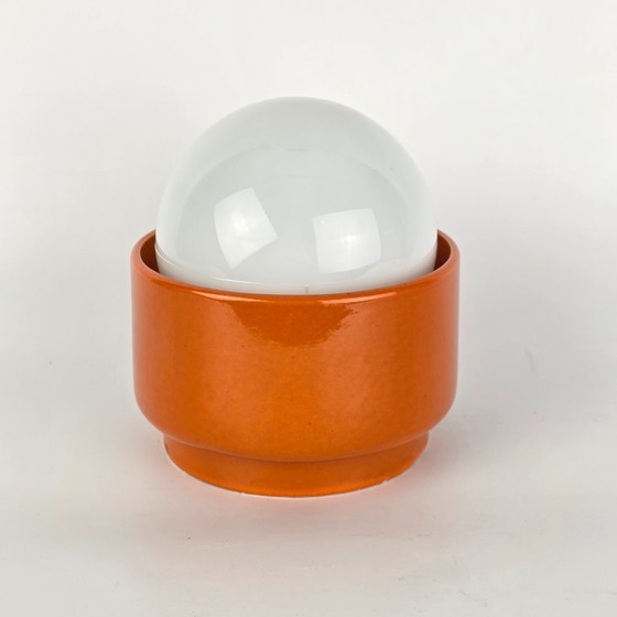 Image 1 of Vintage German ceramic lamp with a glass globe shade. Can be used as a wall lamp, table lamp, or sconce. Orange. 70s / retro