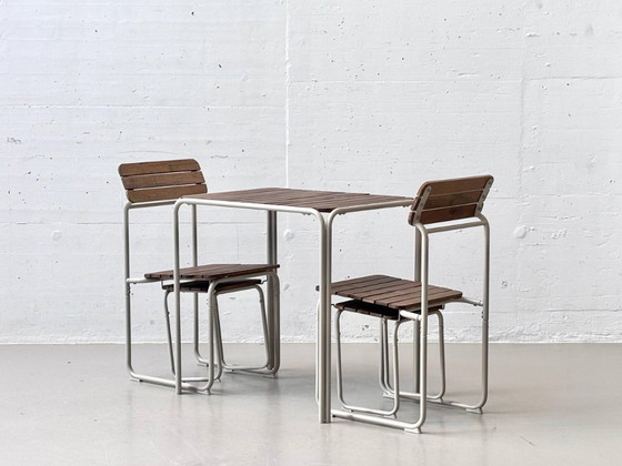 Image 1 of IKEA FURUÖN tuinset met tafel, 2 stoelen en 2 krukjes, gemaakt van acaciahout.