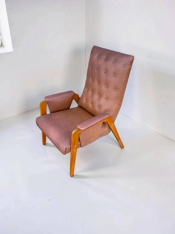 Vintage armchair in light brown faux leather, 1960s. – Wood (photo 4 of 10)