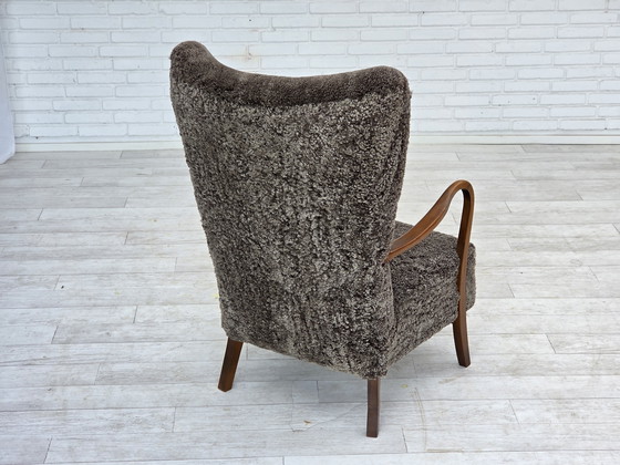 Image 1 of 1960s Reupholstered Danish Armchair with Stool, Genuine Sheepskin