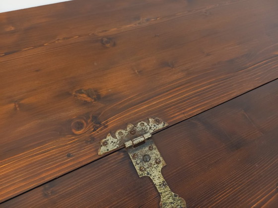 Image 1 of Een laag, brutalistisch dressoir van Georges Robert, gemaakt van donker grenenhout, uit de jaren 50/60.