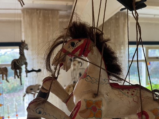 Collection of wooden animal marionettes