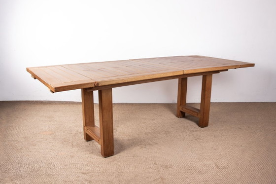 Image 1 of Gran mesa de comedor extensible de roble macizo, diseñada por Guillermo y Chambron en 1960.