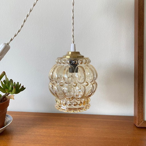 Antique globe pendant lamp with gilded glass and brass suspension bracket