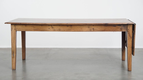 Image 1 of Table de salle à manger ancienne en chêne du début des années 1900 avec plateau rabattable d'un côté