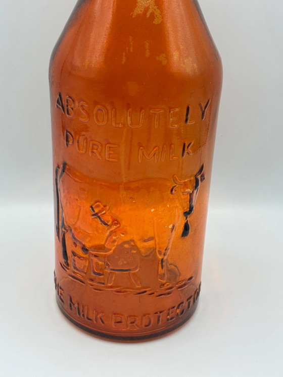 Antike bernsteinfarbene Milchflasche „Absolut reine Milch“ – Der Milchbeschützer – um 1900 (photo 3 of 6)