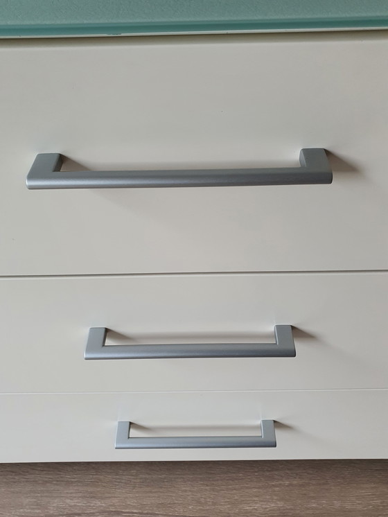 Image 1 of White modern sideboard with a separate glass top. Heavy-duty quality.