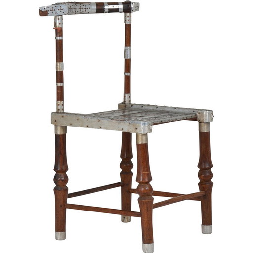 Vintage chair with hammered metal decoration