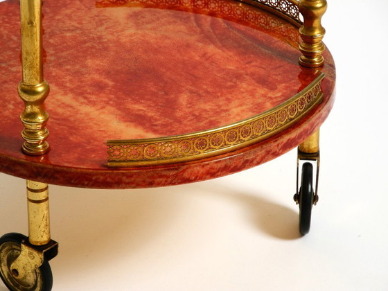 Image 1 of Round, small 1960s Aldo Tura serving or bar trolley in red goatskin leather | Made in Italy