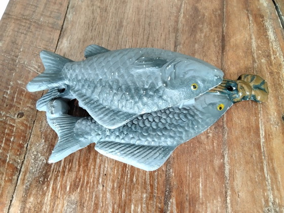 Image 1 of Gietijzeren deurklopper met drie vissen