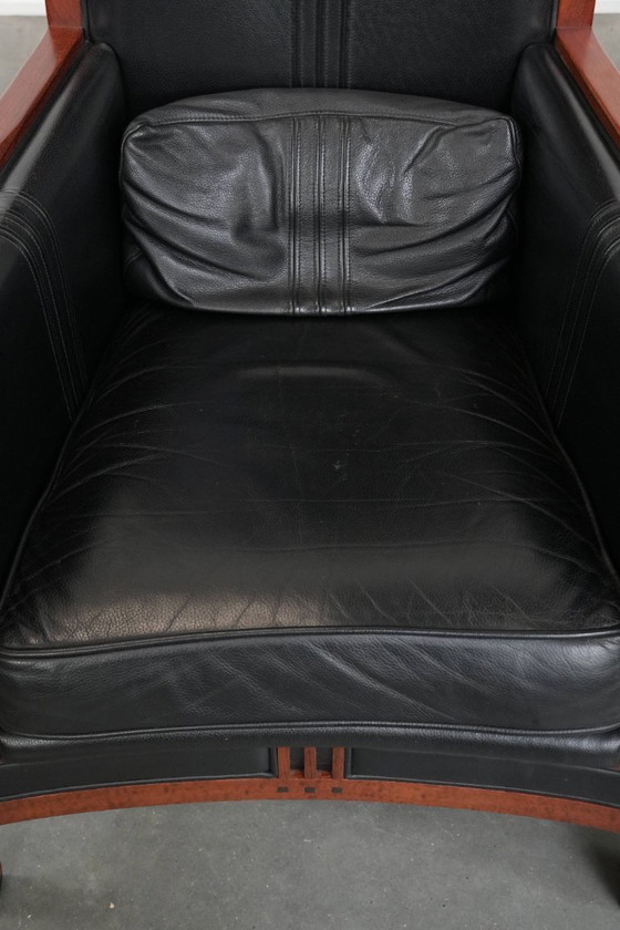 Image 1 of 2 x Black cowhide Art Deco design armchairs with high backs by Schuitema