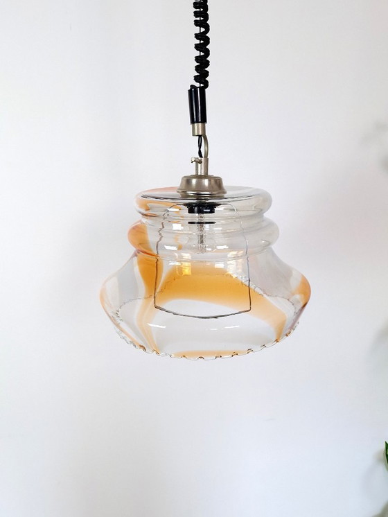 Image 1 of Vintage 1970s Yugoslavian Pendant Light / Mid-Century Glass Ceiling Lamp / Retro Amber Swirl Hanging Light